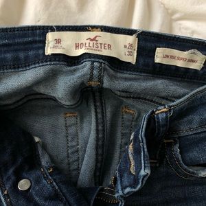 Hollister low rise super skinny dark ripped jeans
